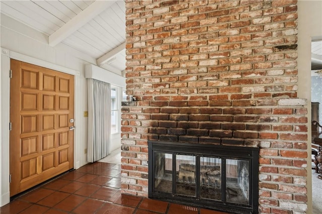 interior details with a fireplace and beam ceiling