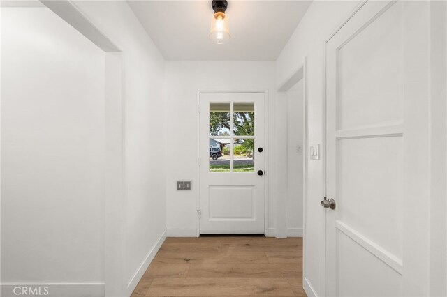 1326 Clock Ave, Redlands, CA 92374 - doorway featuring baseboards and light wood finished floors