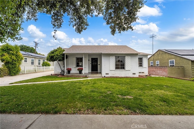 1326 Clock Ave, Redlands, CA 92374 - bungalow featuring fence, stucco siding, concrete driveway, and a front lawn