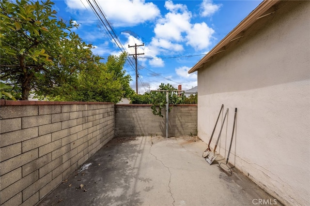 exterior space with a patio, a fenced backyard, and stucco siding