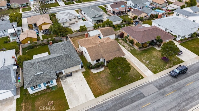 birds eye view of property with a residential view