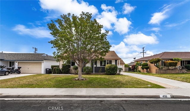 view of front of home featuring a garage, stucco siding, a front yard, and concrete driveway