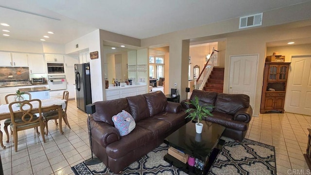 42154 Thoroughbred Ln, Murrieta, CA 92562 - living room with light tile patterned floors, recessed lighting, and stairway