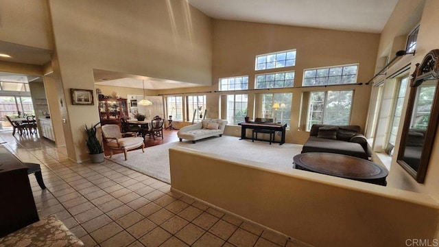 42154 Thoroughbred Ln, Murrieta, CA 92562 - living area featuring plenty of natural light, high vaulted ceiling, and tile patterned floors