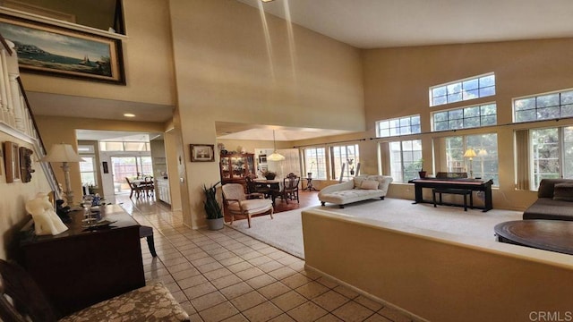 42154 Thoroughbred Ln, Murrieta, CA 92562 - tiled living room featuring plenty of natural light and a towering ceiling