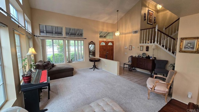 42154 Thoroughbred Ln, Murrieta, CA 92562 - carpeted living area featuring high vaulted ceiling and stairway
