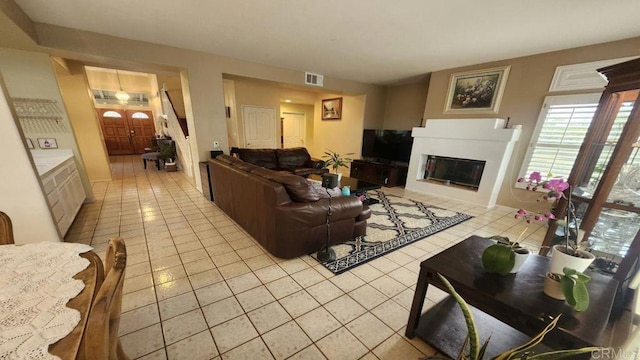 42154 Thoroughbred Ln, Murrieta, CA 92562 - living area featuring light tile patterned floors and a glass covered fireplace