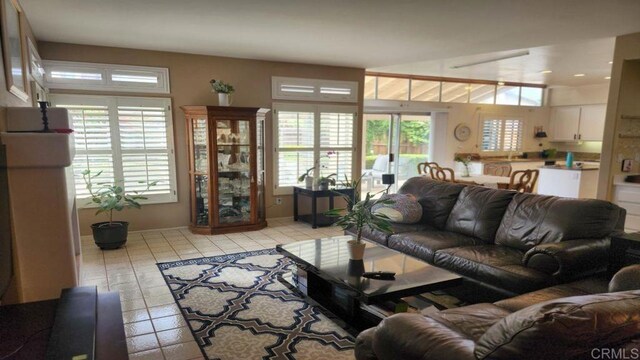 42154 Thoroughbred Ln, Murrieta, CA 92562 - living room with plenty of natural light, light tile patterned flooring, and recessed lighting