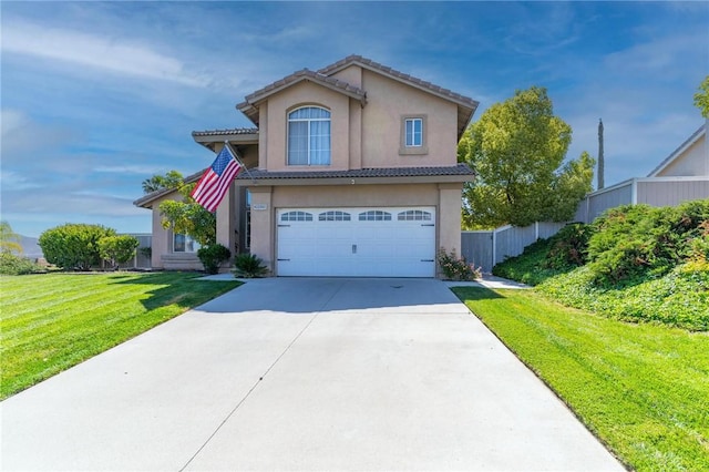 traditional home featuring a front lawn, fence, stucco siding, concrete driveway, and an attached garage