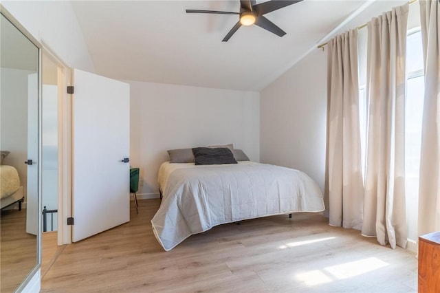 26928 Eagle Run St, Corona, CA 92883 - bedroom featuring light wood-style floors, lofted ceiling, and a ceiling fan