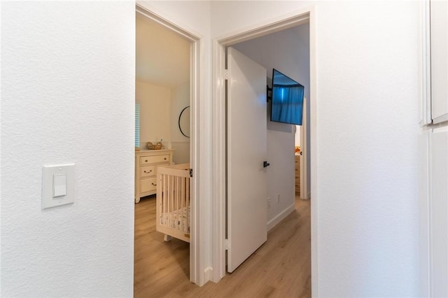 hallway featuring light wood-style floors