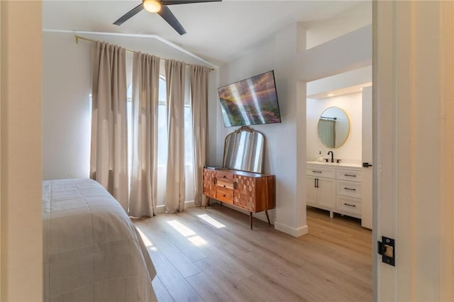 26928 Eagle Run St, Corona, CA 92883 - bedroom with light wood-style floors, lofted ceiling, wet bar, ensuite bathroom, and a ceiling fan