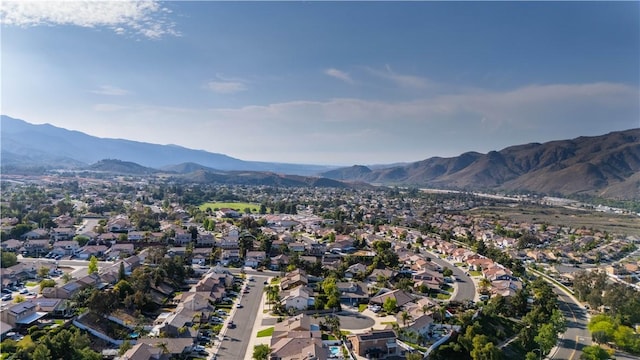 26928 Eagle Run St, Corona, CA 92883 - aerial overview of property's location featuring a mountainous background and nearby suburban area