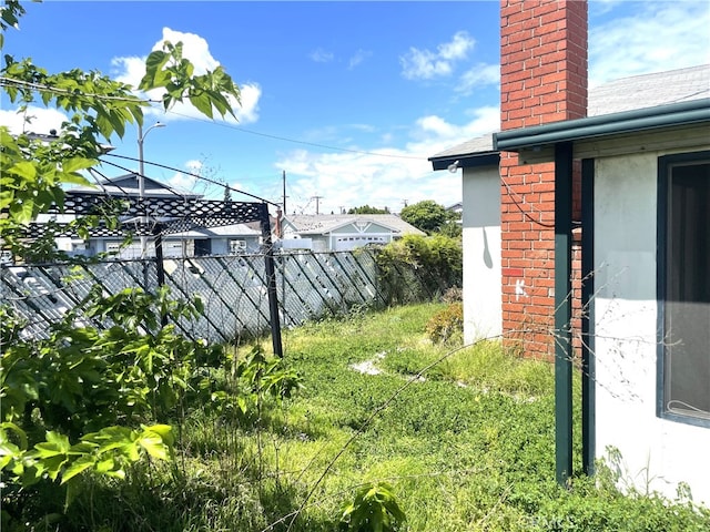 view of yard with fence