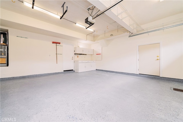 56 Egret Ln, Aliso Viejo, CA 92656 - garage with a garage door opener and baseboards