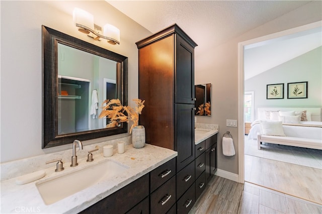 56 Egret Ln, Aliso Viejo, CA 92656 - full bathroom with vanity, lofted ceiling, wood finished floors, and baseboards