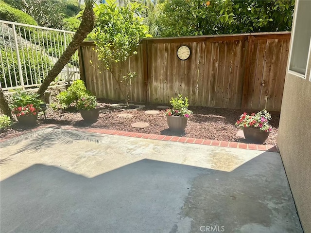view of yard with fence and a patio area