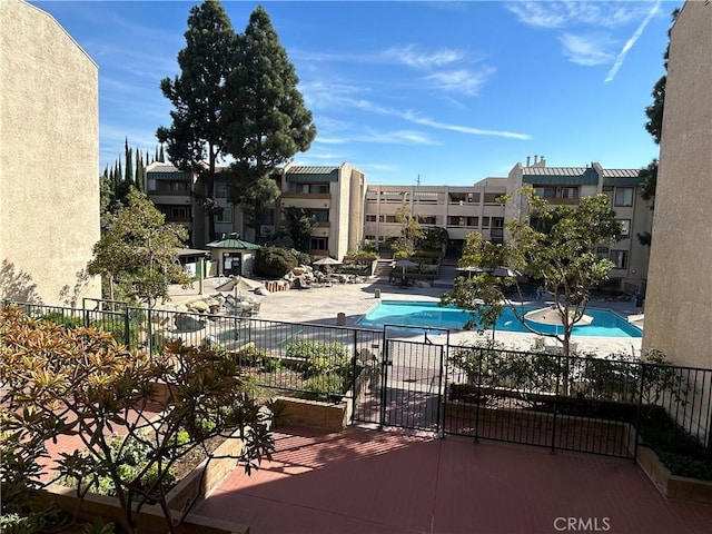 12121 Centralia St Unit 305, Lakewood, CA 90715 - pool featuring fence, a residential view, and a patio area