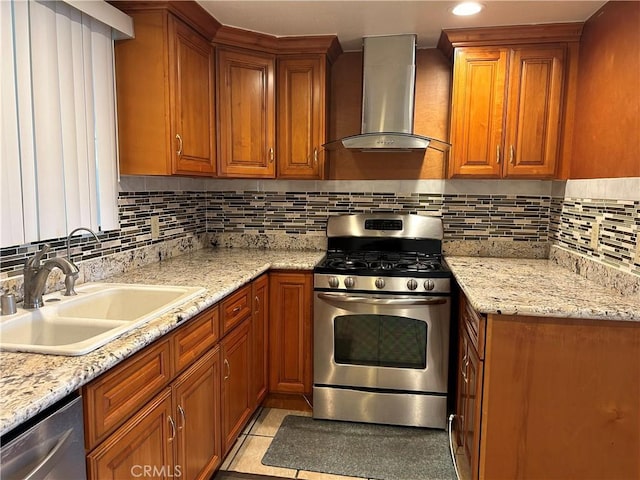 12121 Centralia St Unit 305, Lakewood, CA 90715 - kitchen with wall chimney range hood, brown cabinetry, backsplash, appliances with stainless steel finishes, and a sink