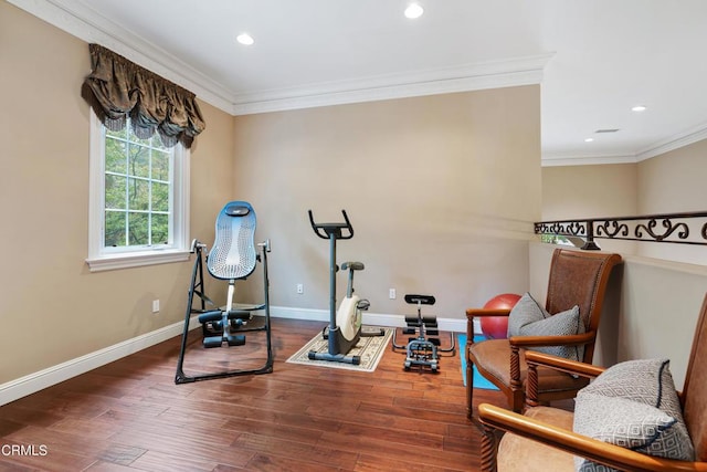 workout room with baseboards, ornamental molding, recessed lighting, and wood finished floors