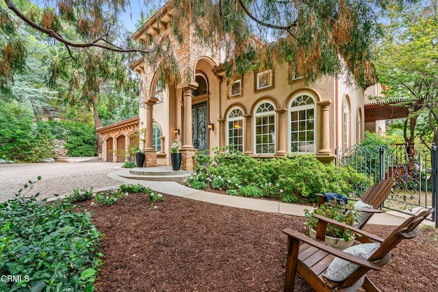 exterior space featuring driveway and stucco siding