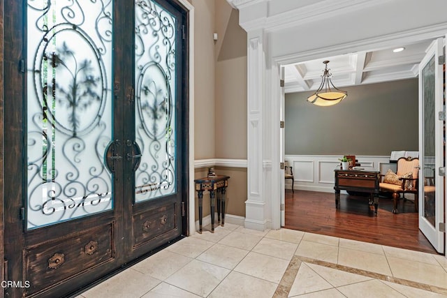 foyer with light tile patterned flooring, beamed ceiling, recessed lighting, french doors, and coffered ceiling