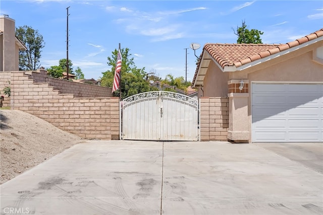 view of gate featuring fence