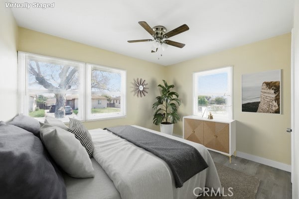 325 W Floral Dr, Monterey Park, CA 91754 - bedroom with baseboards, a ceiling fan, and wood finished floors