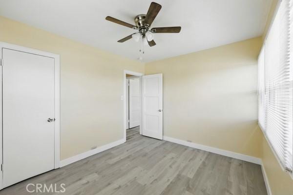 325 W Floral Dr, Monterey Park, CA 91754 - unfurnished bedroom with baseboards, a ceiling fan, and wood finished floors