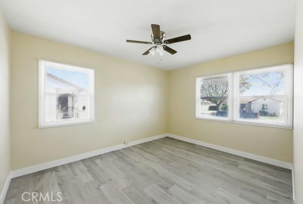 325 W Floral Dr, Monterey Park, CA 91754 - unfurnished room featuring plenty of natural light, a ceiling fan, baseboards, and wood finished floors