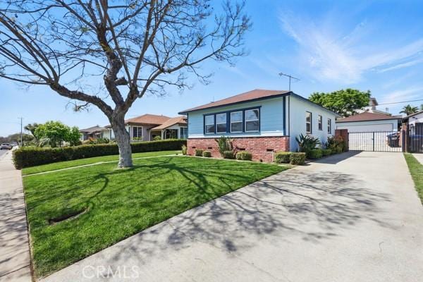 325 W Floral Dr, Monterey Park, CA 91754 - view of front of property with fence, an outbuilding, a front lawn, and brick siding