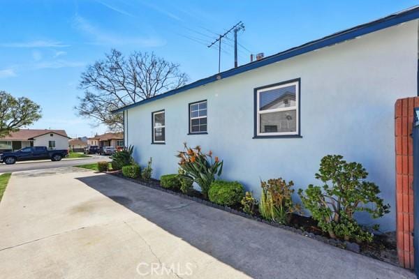 325 W Floral Dr, Monterey Park, CA 91754 - view of side of home featuring stucco siding