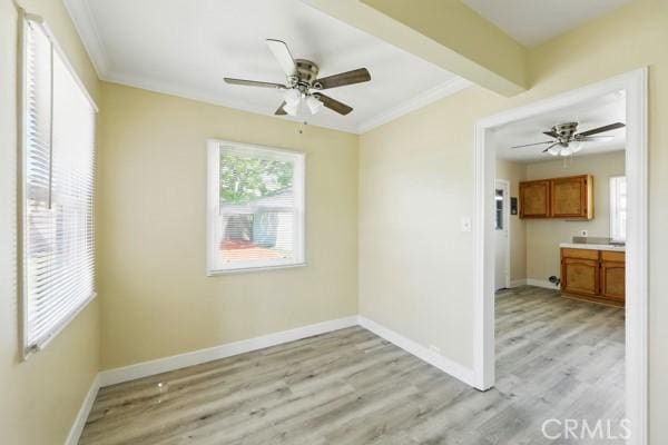 325 W Floral Dr, Monterey Park, CA 91754 - unfurnished room featuring crown molding, light wood-style floors, ceiling fan, and baseboards