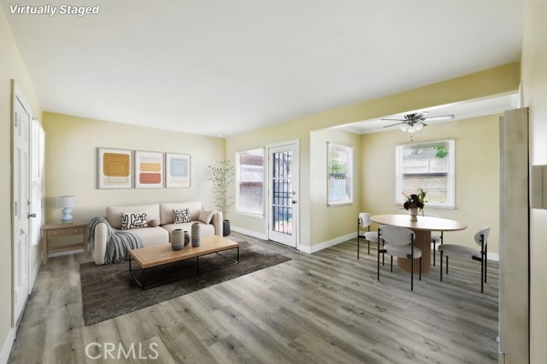 325 W Floral Dr, Monterey Park, CA 91754 - living room featuring baseboards, a ceiling fan, and wood finished floors