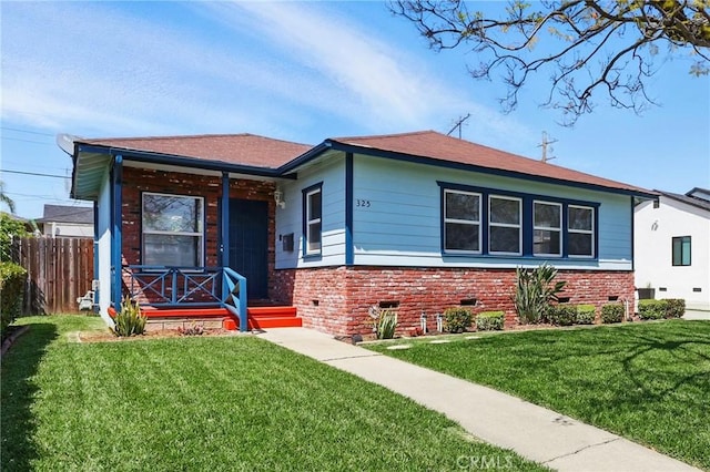 325 W Floral Dr, Monterey Park, CA 91754 - view of front of house featuring fence, a front lawn, brick siding, and crawl space