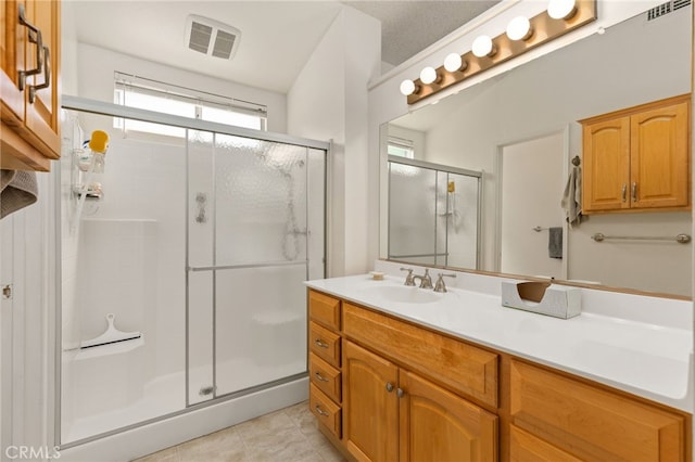 429 Indian Wells Rd, Banning, CA 92220 - bathroom with a stall shower, vanity, and tile patterned floors