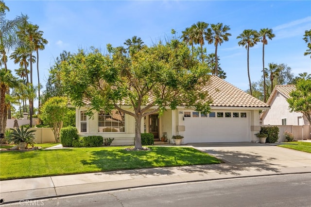 429 Indian Wells Rd, Banning, CA 92220 - obstructed view of property featuring an attached garage, stucco siding, concrete driveway, and a tile roof
