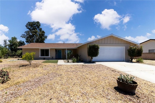 ranch-style house with a garage and concrete driveway