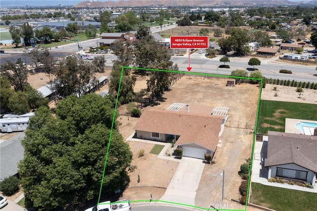 aerial overview of property's location with property boundaries highlighted and mountains