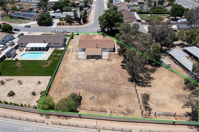 aerial view of residential area with property boundaries highlighted and a pool