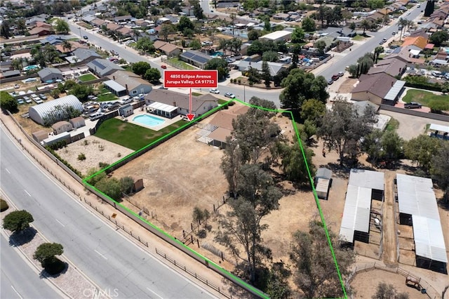 aerial perspective of suburban area with property boundaries highlighted