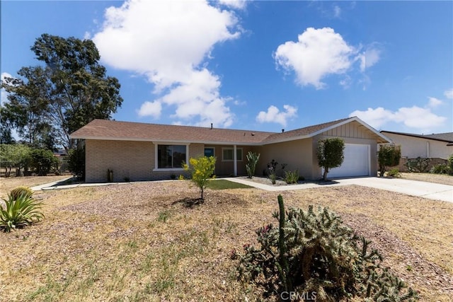 ranch-style house with concrete driveway, a garage, and brick siding