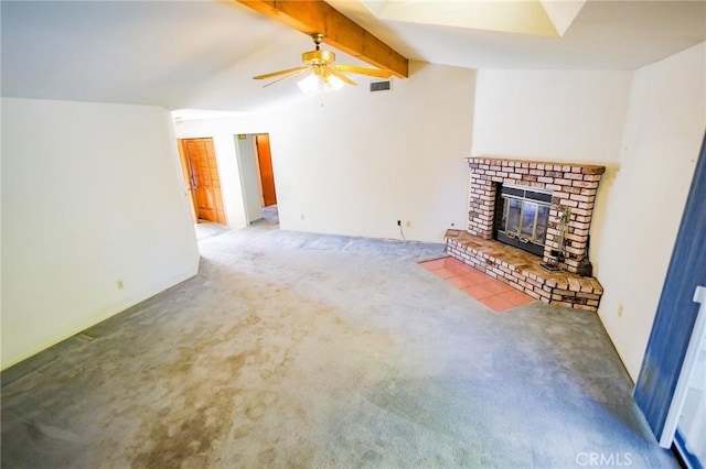 unfurnished living room with visible vents, carpet floors, a brick fireplace, ceiling fan, and lofted ceiling with beams