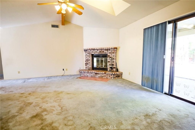 unfurnished living room featuring carpet floors, ceiling fan, visible vents, and vaulted ceiling with beams