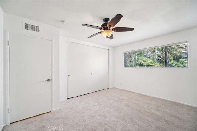 12031 Beverly Blvd Unit 1D, Whittier, CA 90601 - unfurnished bedroom featuring carpet flooring, a closet, a ceiling fan, and visible vents