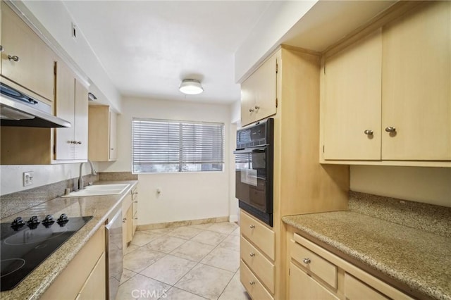 kitchen featuring a sink, light countertops, baseboards, light tile patterned floors, and black appliances