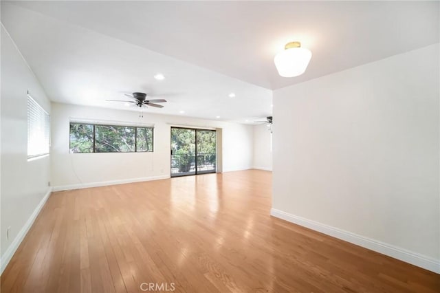 spare room with recessed lighting, baseboards, ceiling fan, and light wood finished floors