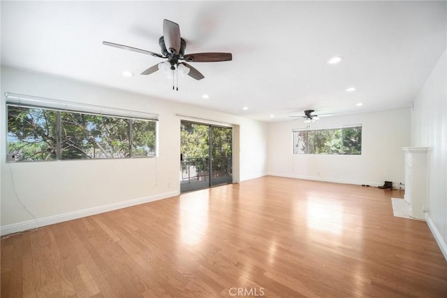 interior space featuring recessed lighting, a ceiling fan, and light wood finished floors