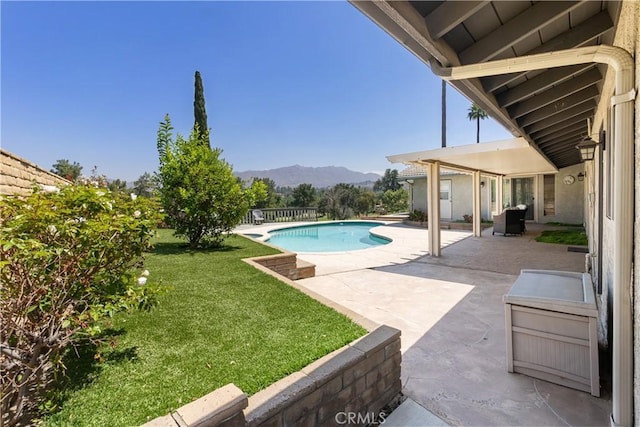 5410 Via, San Jacinto, Riverside, CA 92506 - view of swimming pool featuring a mountain view, a lawn, and a patio