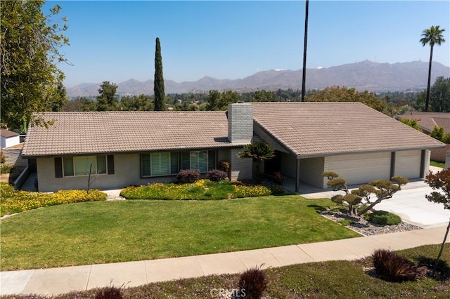 5410 Via, San Jacinto, Riverside, CA 92506 - ranch-style home featuring a tiled roof, a mountain view, and a front lawn